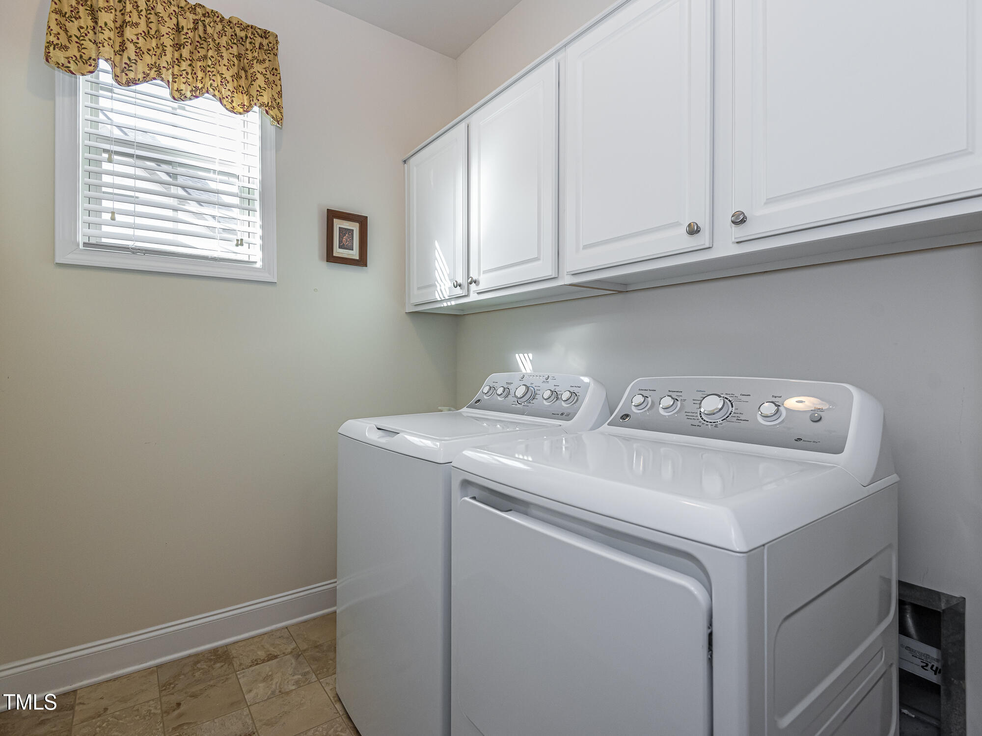 7512 Channery Way Raleigh, NC 27616 - Photo 32 of 45 a utility room with dryer and washer