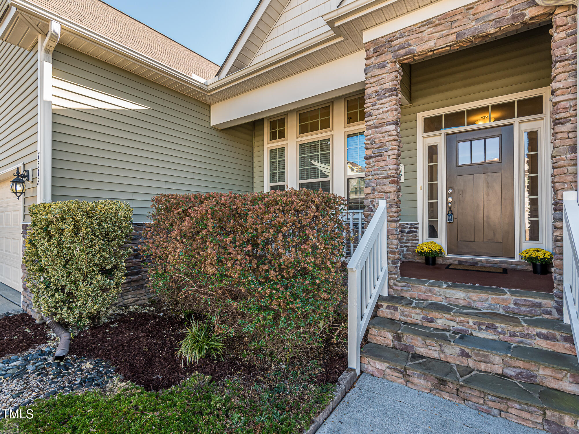 7512 Channery Way Raleigh, NC 27616 - Photo 41 of 45 a front view of a house with a garden
