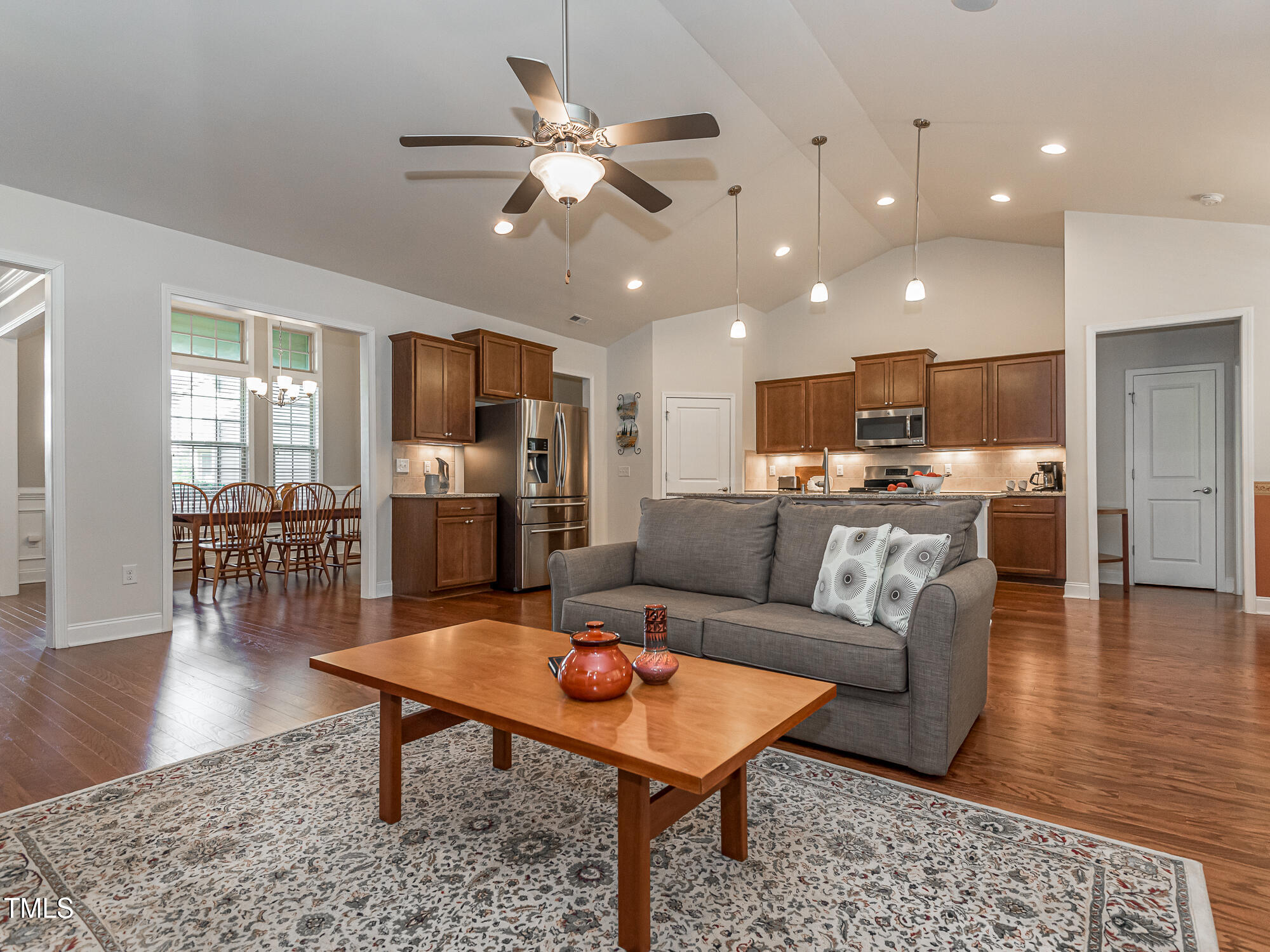 7512 Channery Way Raleigh, NC 27616 - Photo 6 of 45 a living room with furniture kitchen view and a wooden floor