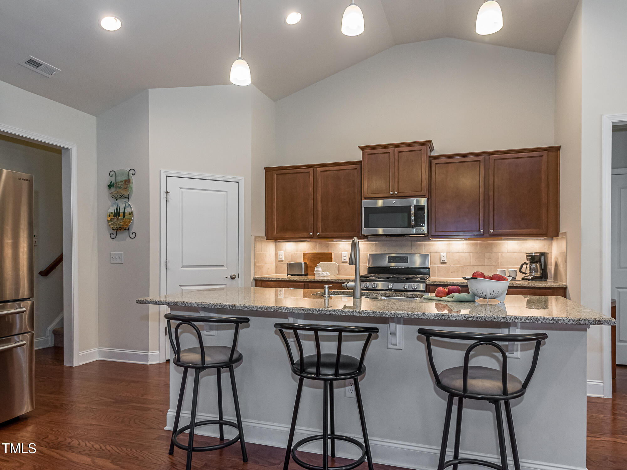 7512 Channery Way Raleigh, NC 27616 - Photo 10 of 45 a kitchen with stainless steel appliances a sink stove and refrigerator