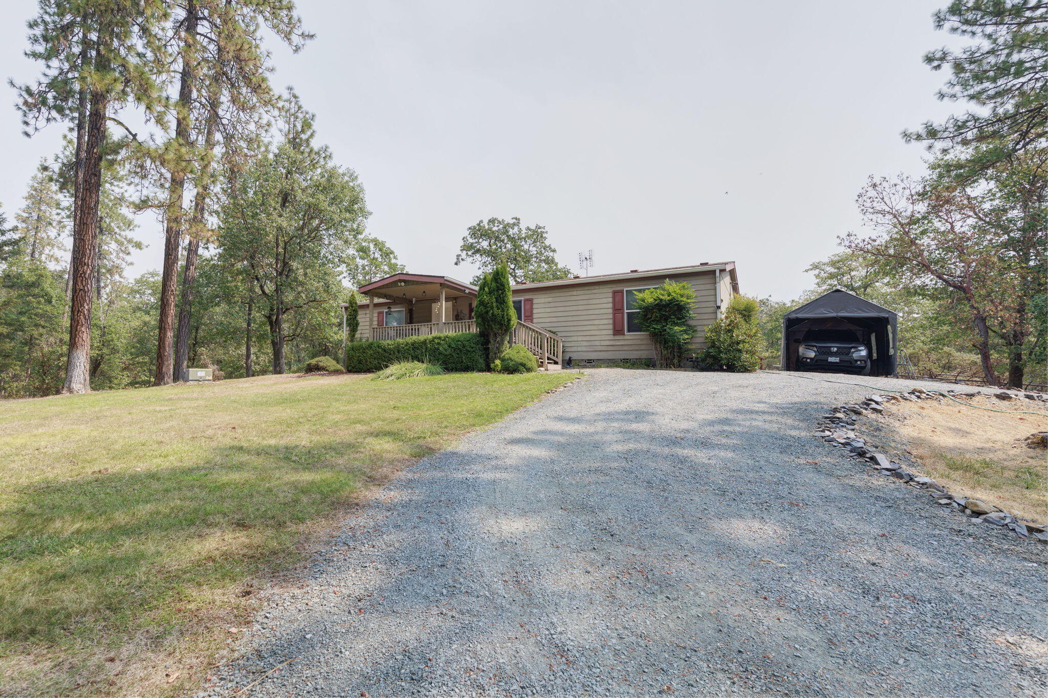 2040 Robertson Bridge Road Grants Pass, OR 97526 - Photo 25 of 39 a view of a house with a yard and garage