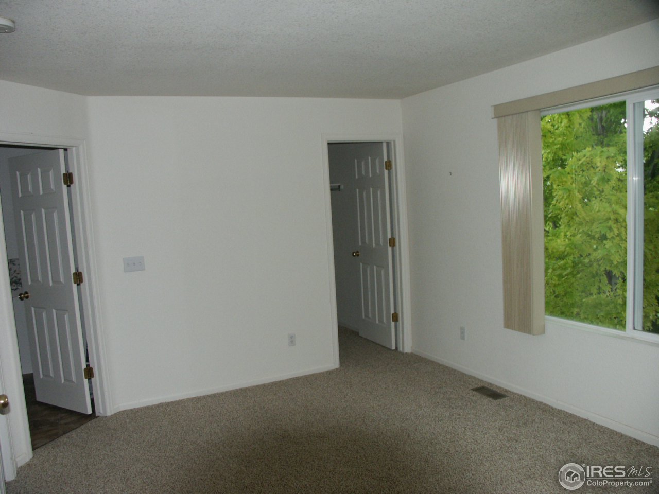 1338 Trail Ridge Road Longmont, CO 80504 - Photo 5 of 13 a view of empty room with window