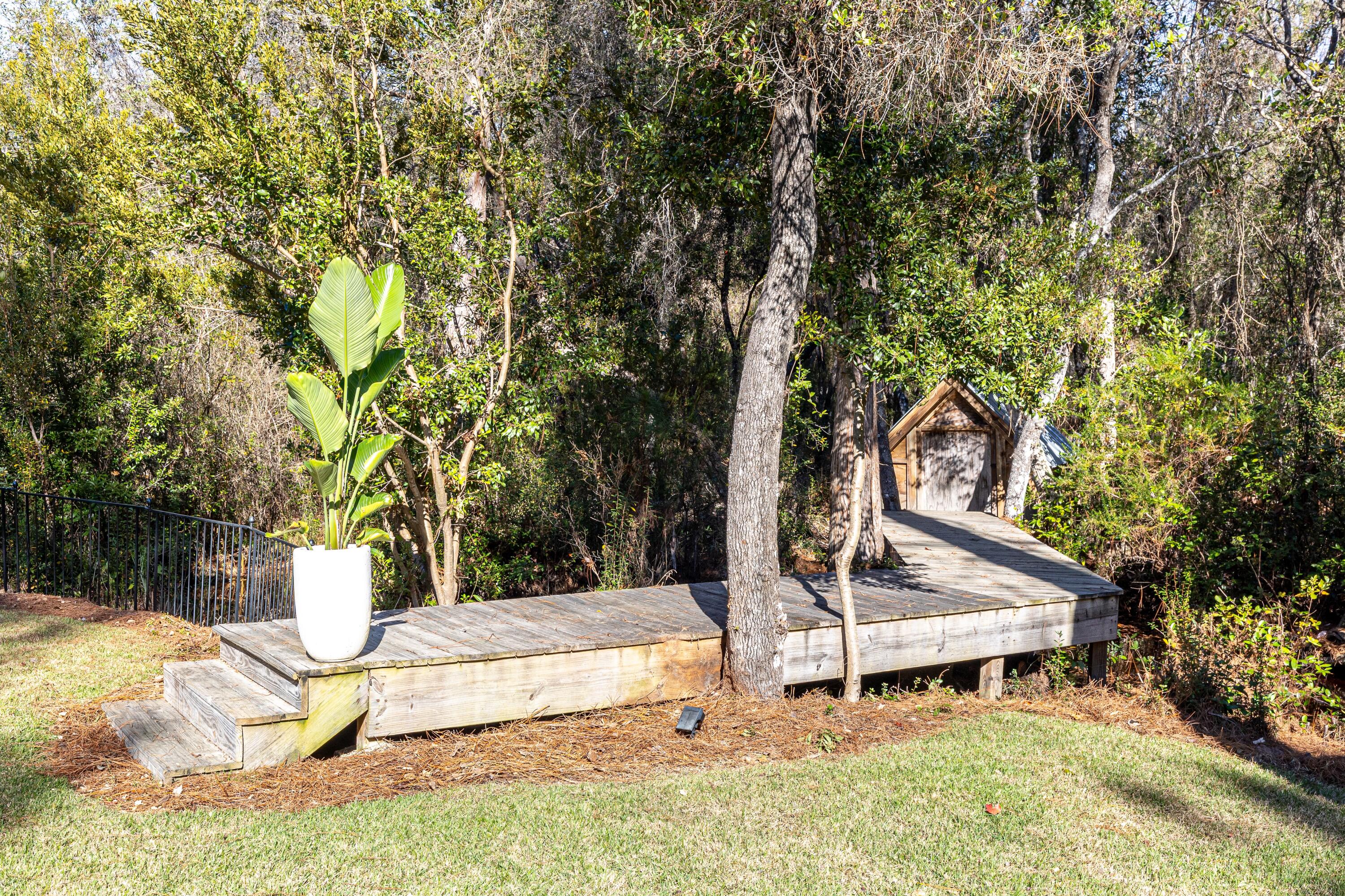 59 Chelsey Lane Santa Rosa Beach, FL 32459 - Photo 27 of 41 a wooden bench sitting in the middle of a yard