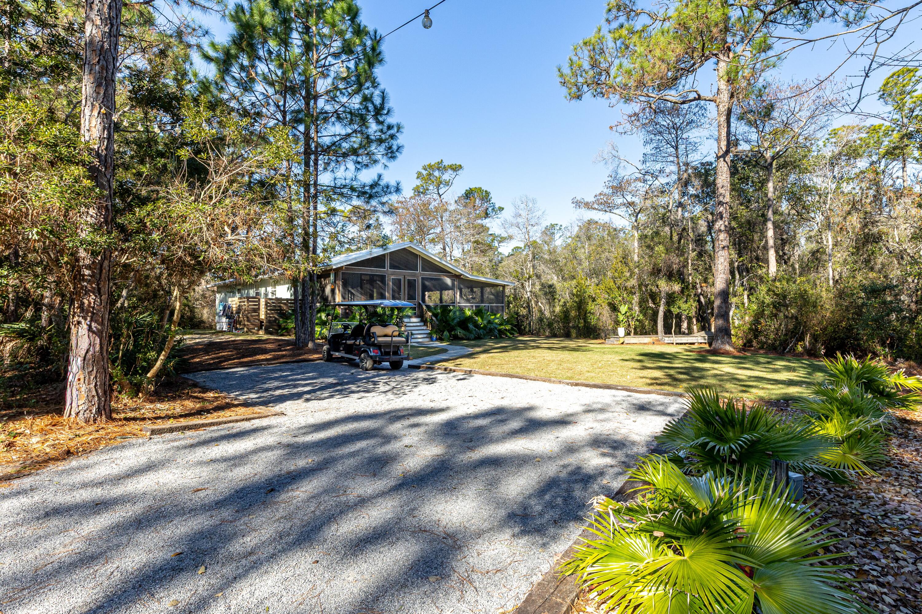 59 Chelsey Lane Santa Rosa Beach, FL 32459 - Photo 32 of 41 a view of swimming pool with lawn chairs yard