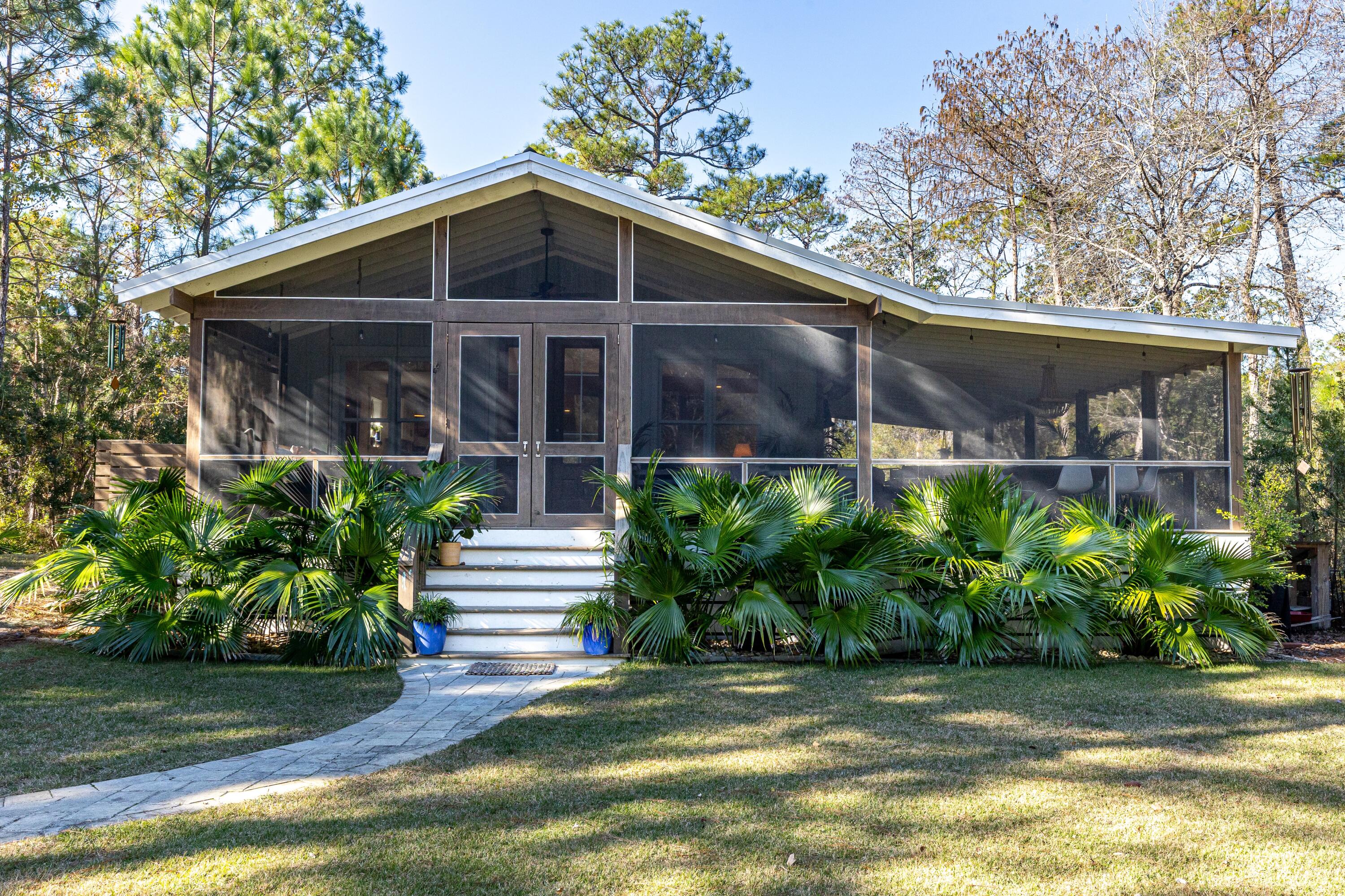 59 Chelsey Lane Santa Rosa Beach, FL 32459 - Photo 33 of 41 a front view of a house with garden