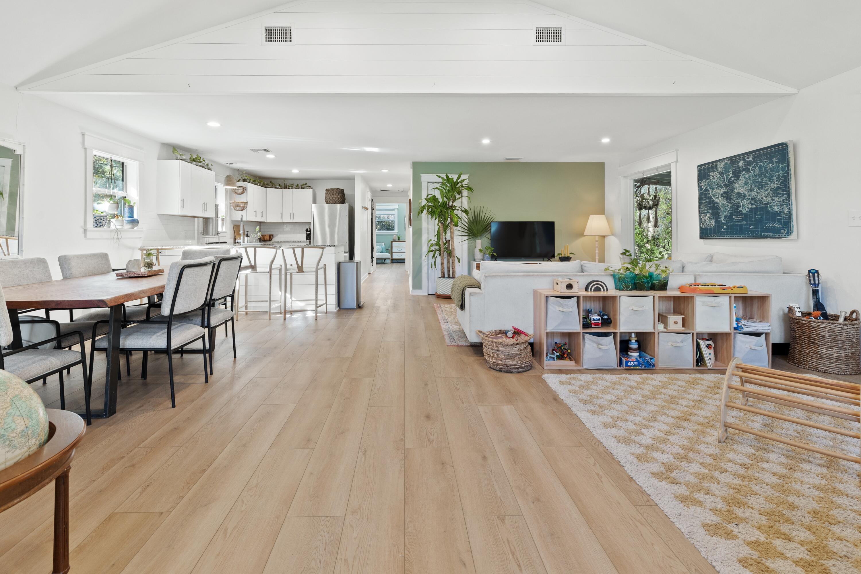 59 Chelsey Lane Santa Rosa Beach, FL 32459 - Photo 9 of 41 a living room with furniture a flat screen tv and a hard wood floor