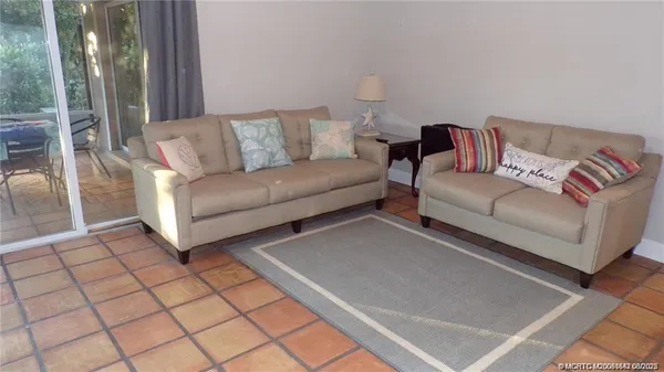 a living room with furniture and a couch