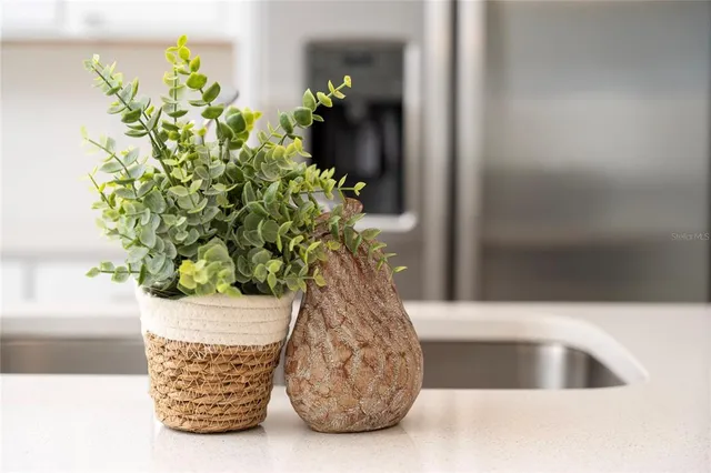 a view of a hallway with wooden floor and entryway