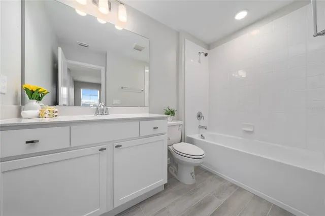 a bedroom with bed and window