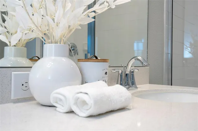 a bathroom with a double vanity sink and mirror