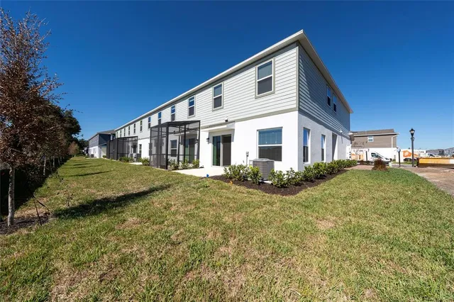 a view of house along with the road and shops
