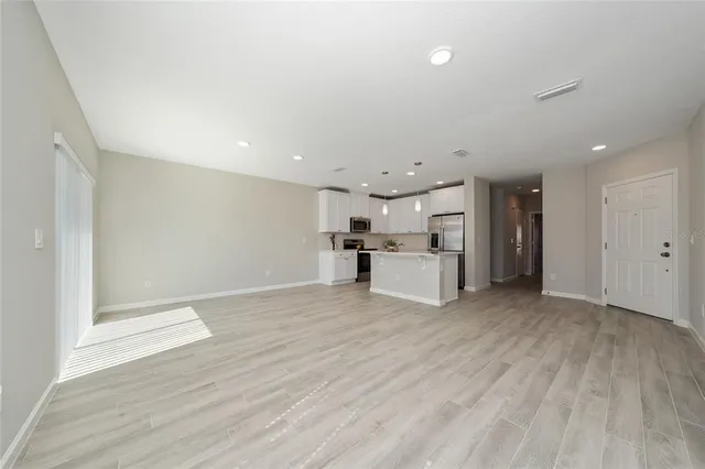 a view of kitchen with wooden floor