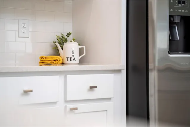 a stove top oven sitting inside of a kitchen