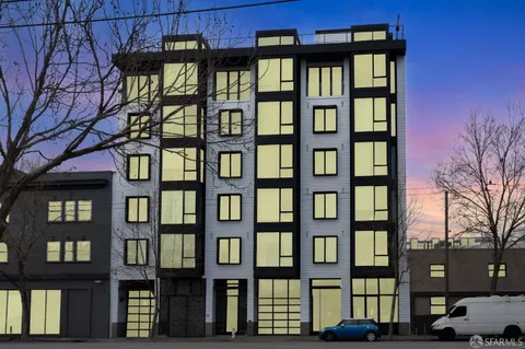 a front view of a building with glass windows and door