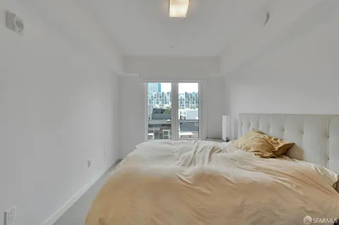 a bedroom with a bed and window