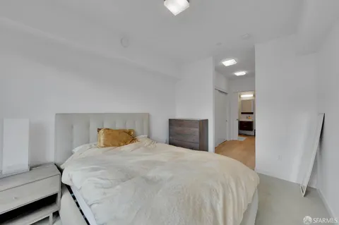 a bedroom with a bed and a couch