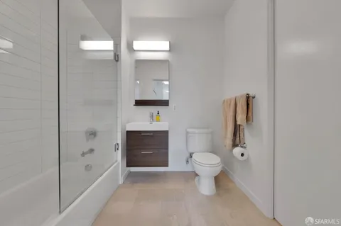a bathroom with a toilet sink and a bathtub