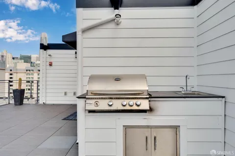 a stove top oven sitting inside of a kitchen