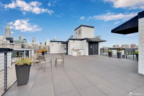 a view of a kitchen with furniture and a flat screen tv
