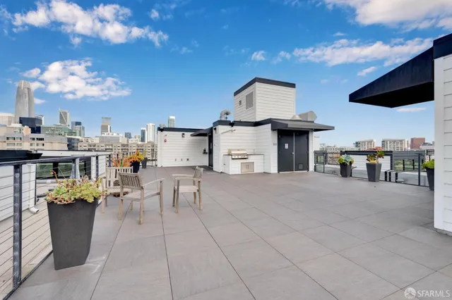 a view of a kitchen with furniture and a flat screen tv