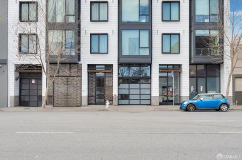 a car parked in front of brick building