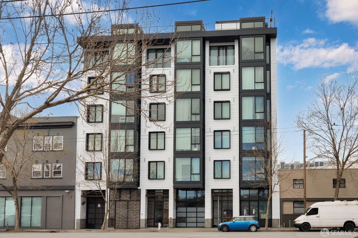 870 Harrison Street, Unit 302 San Francisco, CA 94107 - Photo 39 of 41 a front view of a building with a lot of windows