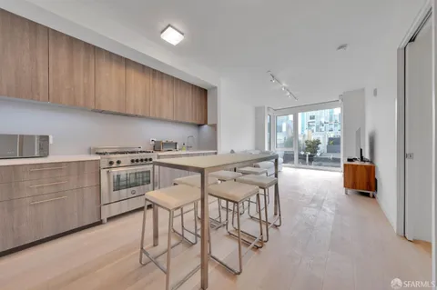 a kitchen with counter top space cabinets and stainless steel appliances