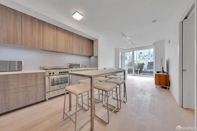 a kitchen with counter top space cabinets and stainless steel appliances