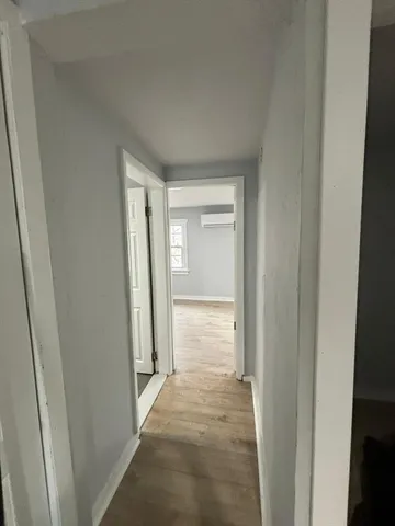 a view of a bathroom from a hallway