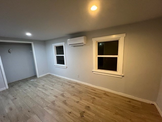 9 Winthrop Street Worcester, MA 01604 - Photo 14 of 30 a view of an empty room with window and wooden floor