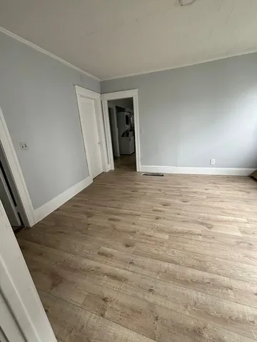 a view of an empty room and closet
