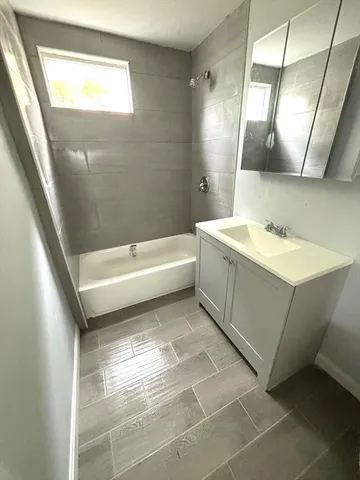 a bathroom with a sink a toilet and a bathtub