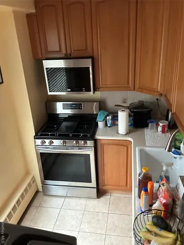 a white refrigerator freezer and a dishwasher sitting in a kitchen