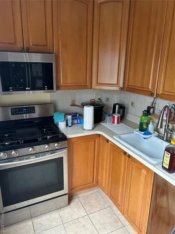 a view of a chairs and table in the balcony