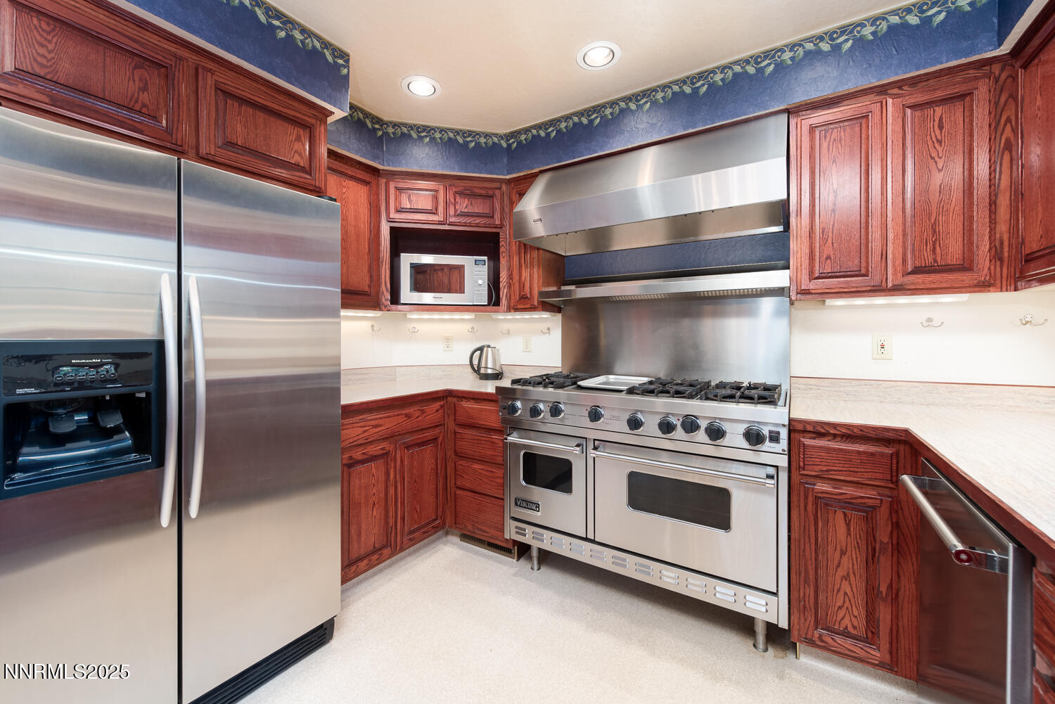 100 Timber Lane Markleeville, CA 96120 - Photo 14 of 29 a kitchen with stainless steel appliances granite countertop a stove and a refrigerator