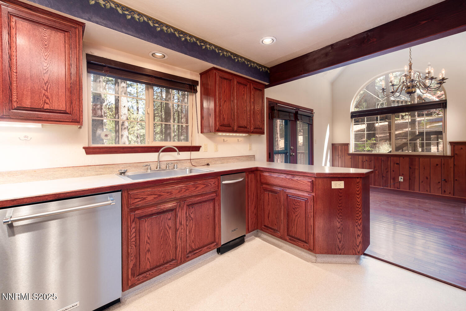 100 Timber Lane Markleeville, CA 96120 - Photo 15 of 29 a kitchen with stainless steel appliances granite countertop wooden cabinets a sink and a large window
