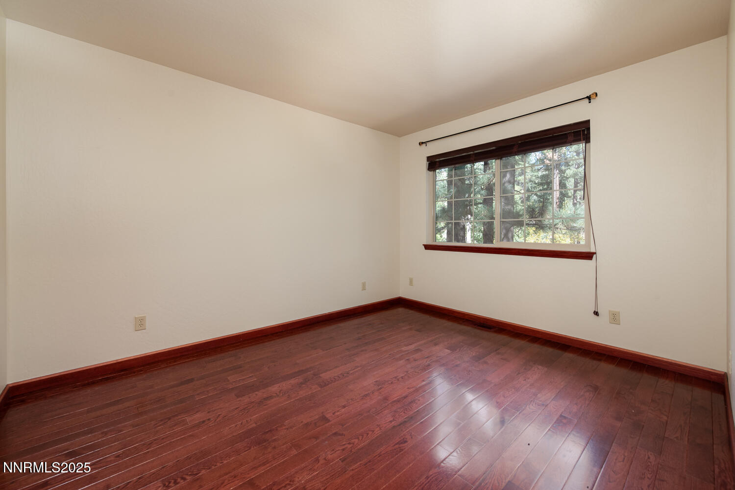 100 Timber Lane Markleeville, CA 96120 - Photo 18 of 29 an empty room with wooden floor and windows
