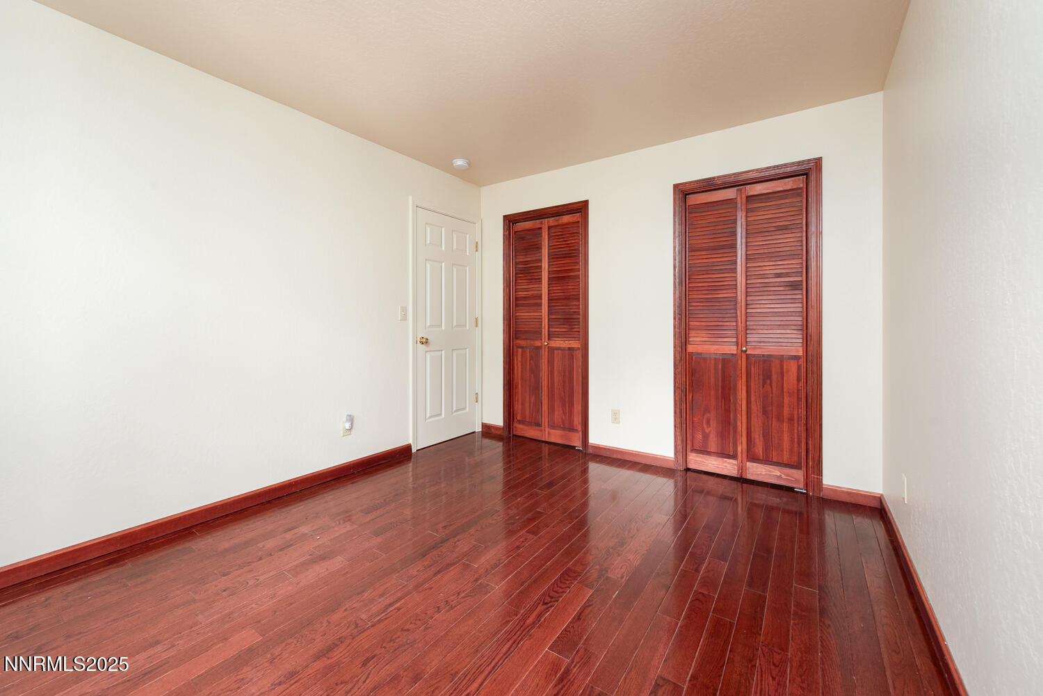 100 Timber Lane Markleeville, CA 96120 - Photo 19 of 29 an empty room with wooden floor and closet