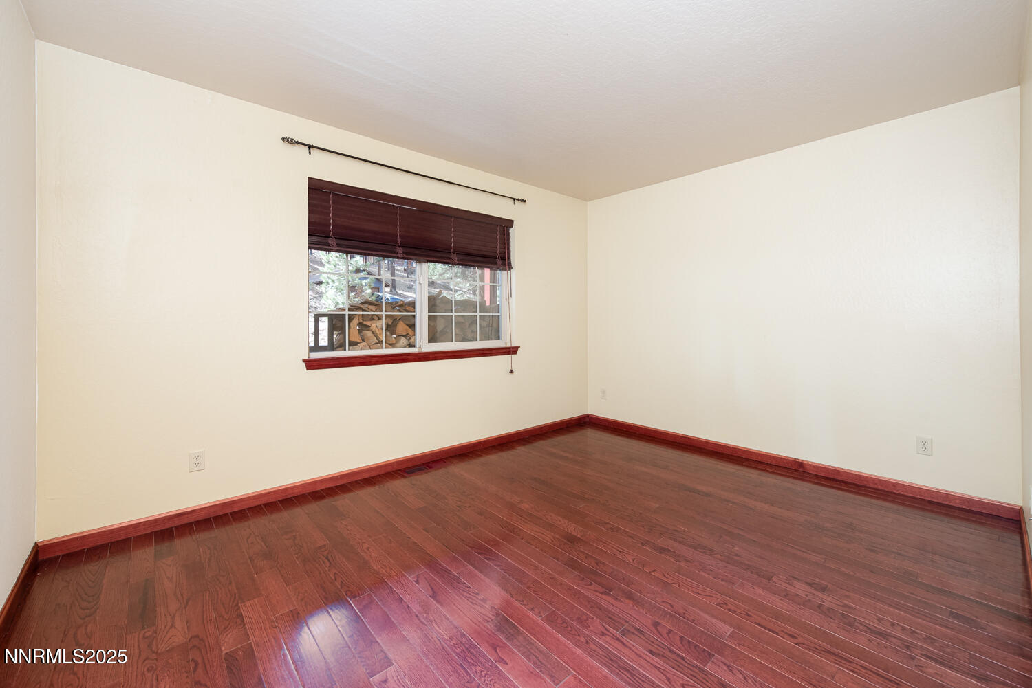 100 Timber Lane Markleeville, CA 96120 - Photo 22 of 29 an empty room with wooden floor and windows