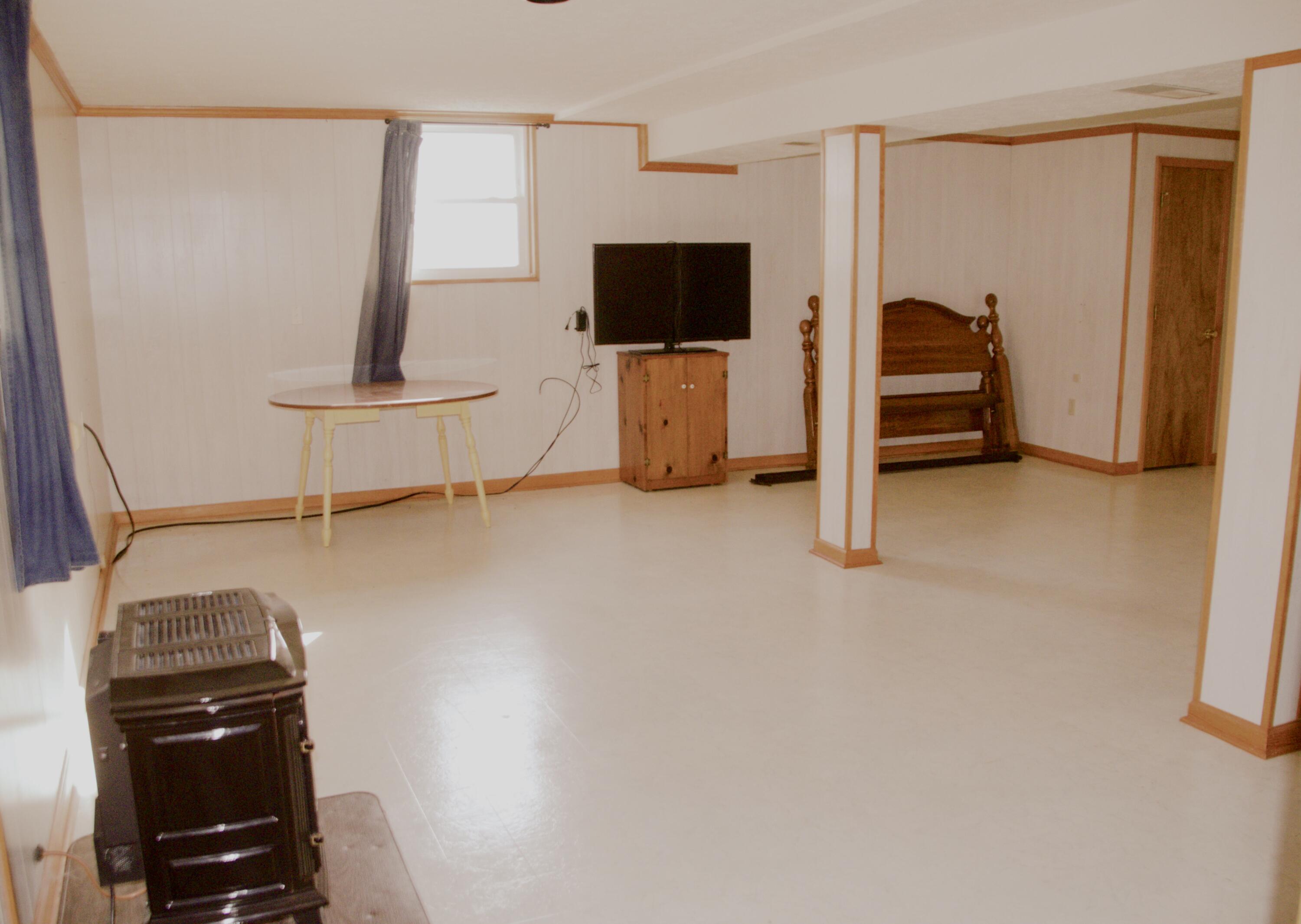 420 Emery Road Chatham, VA 24531 - Photo 14 of 18 a view of a livingroom with furniture and a flat screen tv