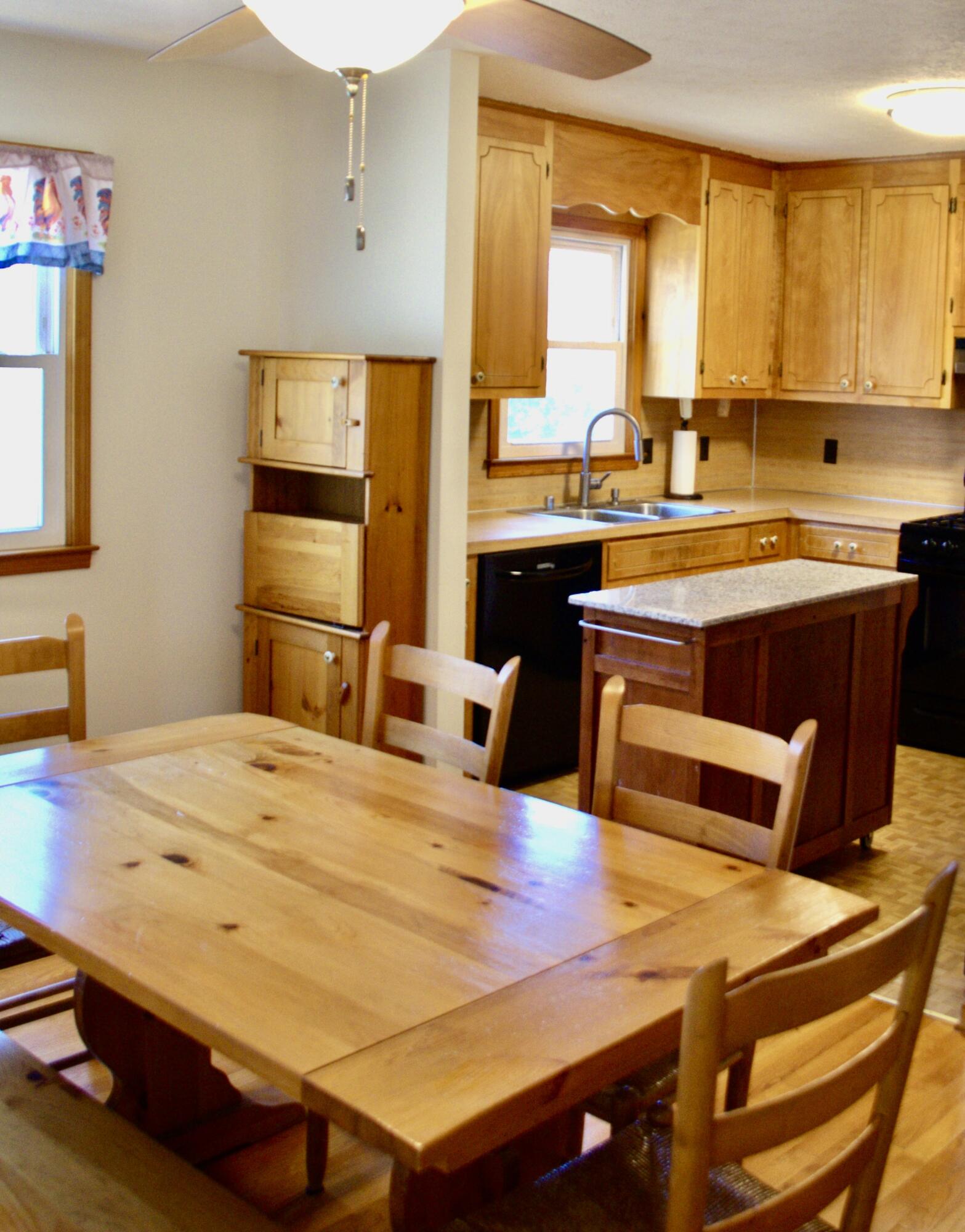 420 Emery Road Chatham, VA 24531 - Photo 4 of 18 a kitchen with kitchen island a sink table and chairs