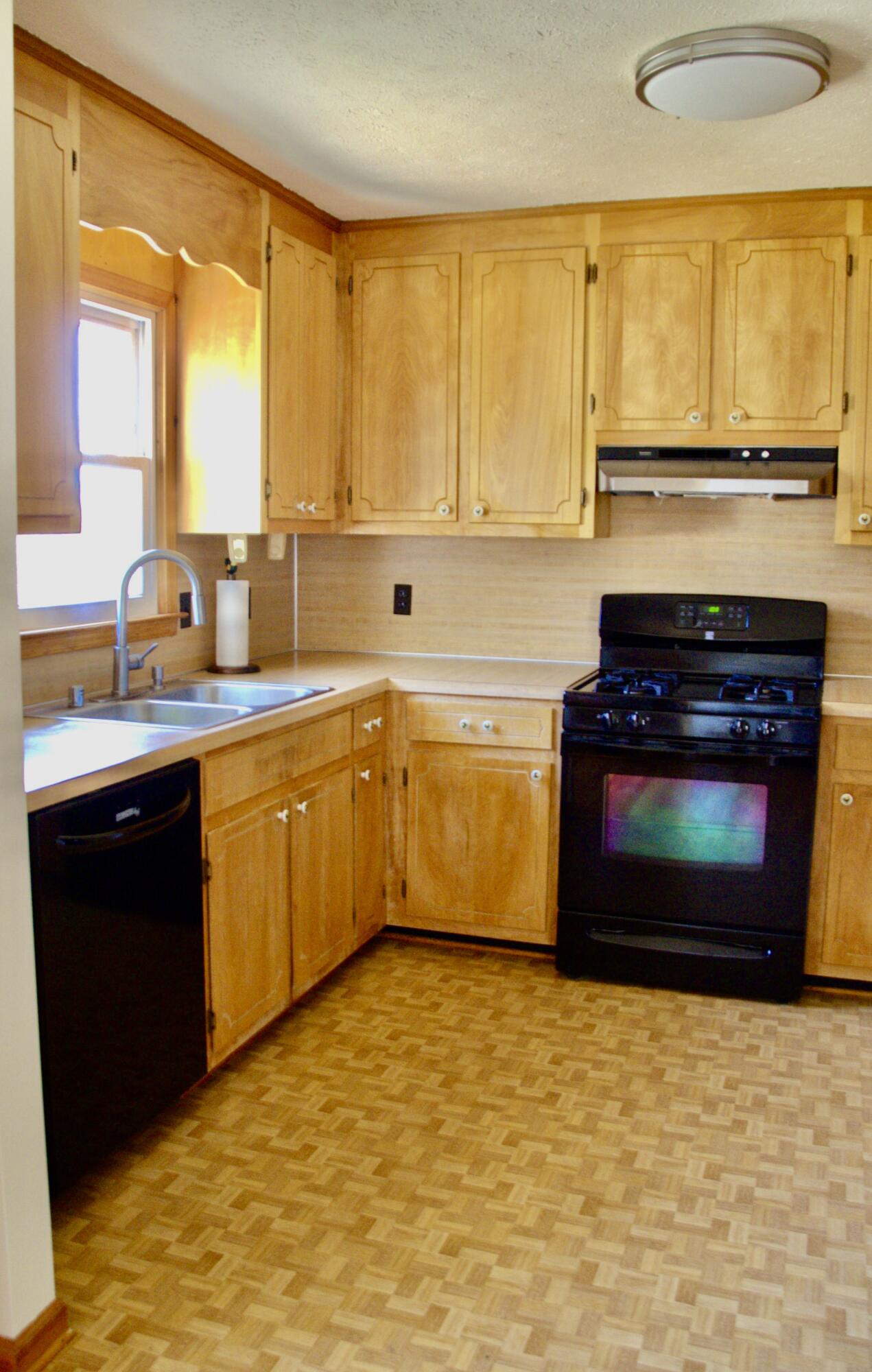 420 Emery Road Chatham, VA 24531 - Photo 5 of 18 a kitchen with stainless steel appliances a stove sink and cabinets