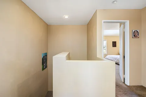 a hallway with a refrigerator