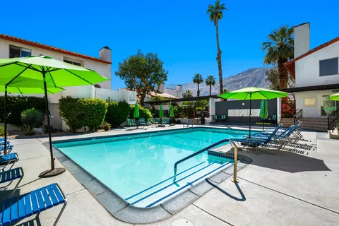 a view of swimming pool with outdoor seating and yard