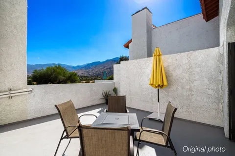 a view of a table and chairs in patio