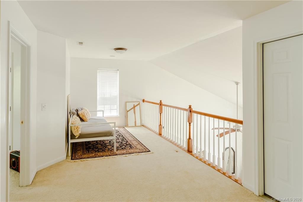 162 Snead Road Fort Mill, SC 29715 - Photo 14 of 25 a view of a hallway with wooden floor and staircase