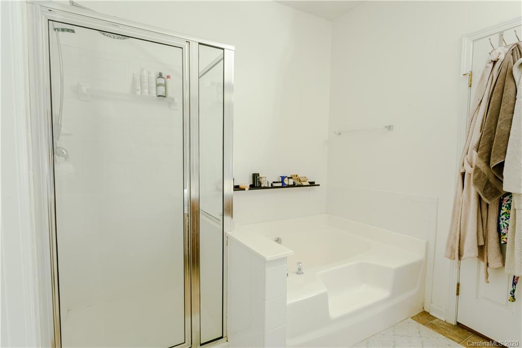 162 Snead Road Fort Mill, SC 29715 - Photo 22 of 25 a bathroom with a bathtub and a shower