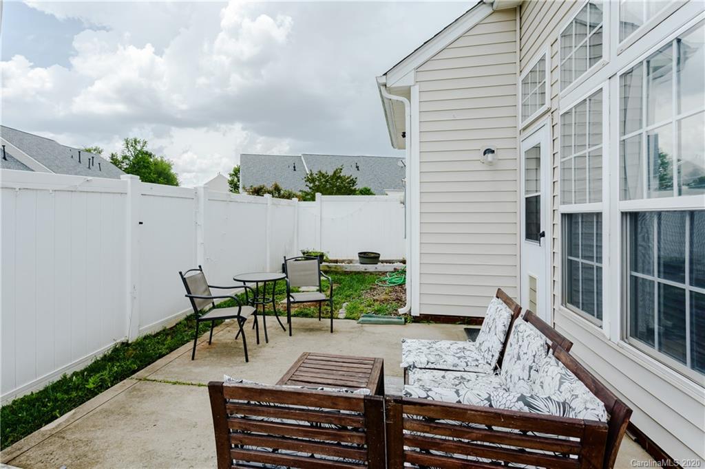 162 Snead Road Fort Mill, SC 29715 - Photo 25 of 25 a view of a patio with couches table and chairs with potted plants