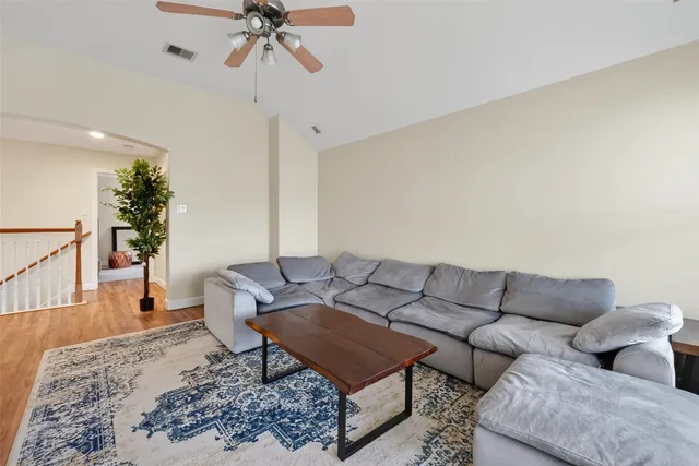 a living room with furniture and a rug