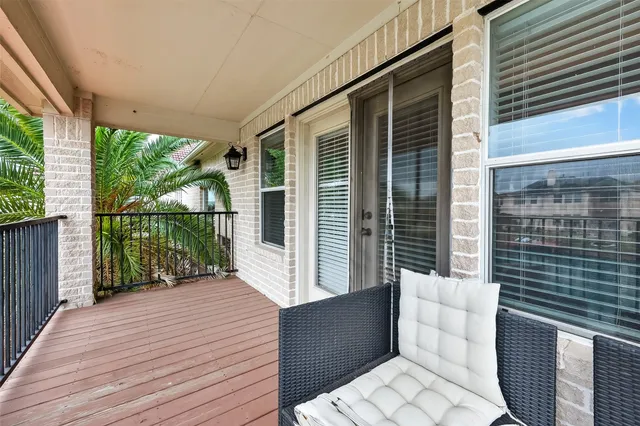 a balcony with wooden floor